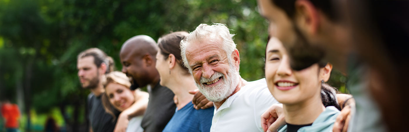 group of people smiling at each other