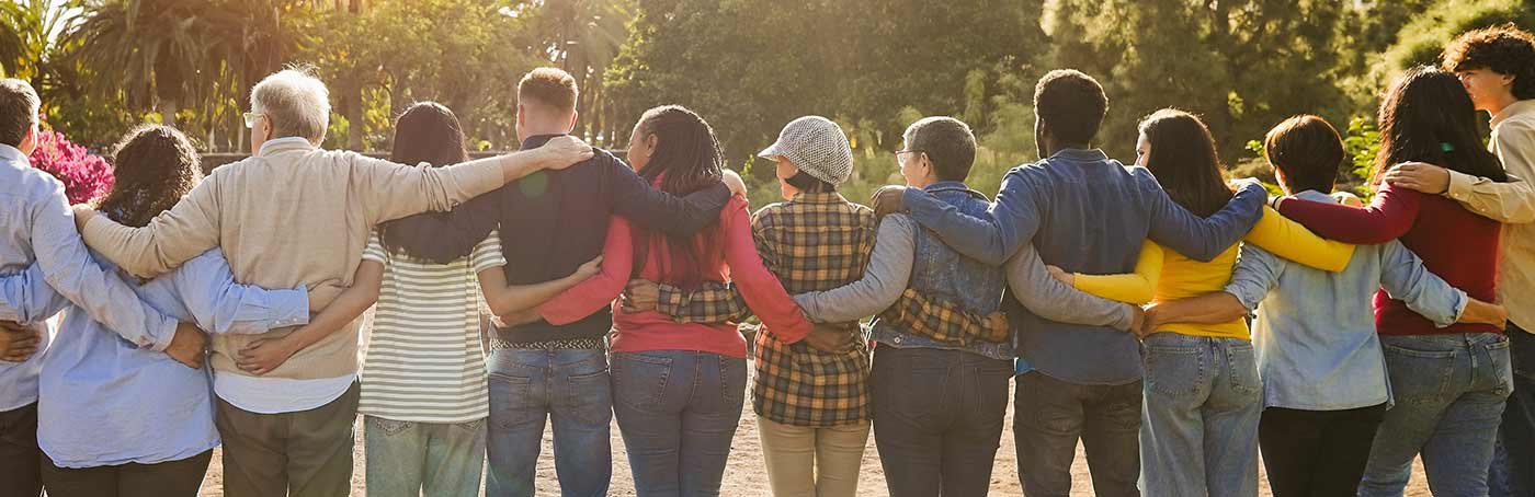 people with their arms around each other