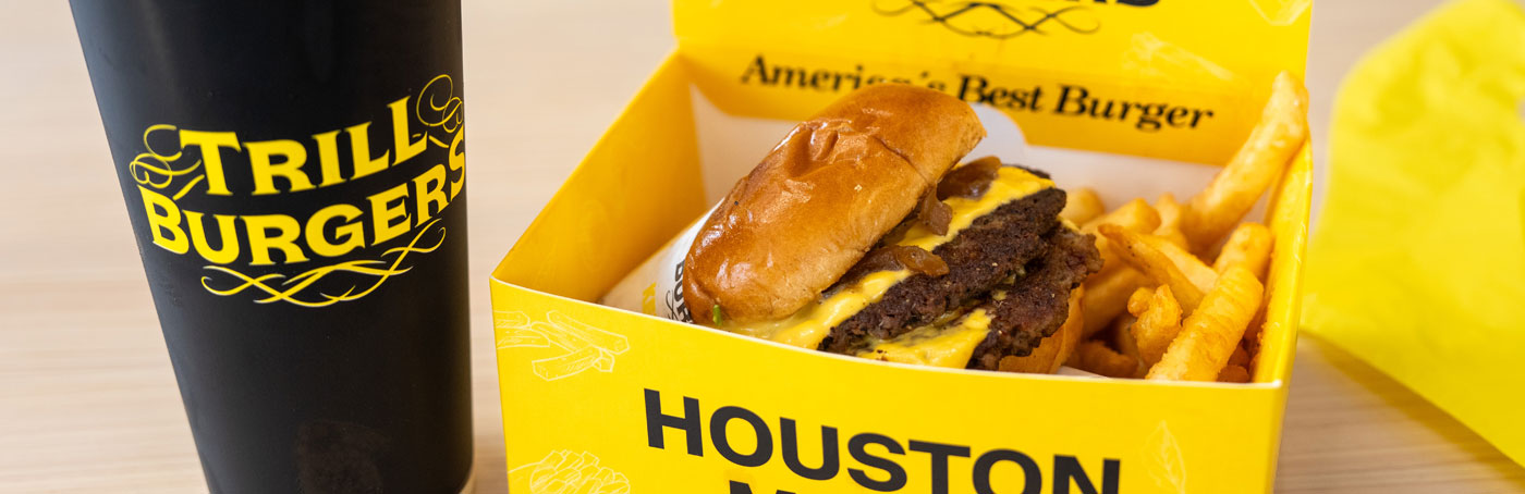 A Trill Burgers combo meal with a double cheeseburger, fries, and a drink